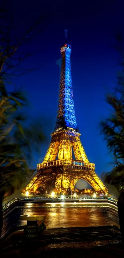 Illuminated Eiffel Tower against a vibrant blue nighttime sky.