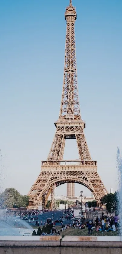 Mobile wallpaper of the Eiffel Tower in Paris with a blue sky backdrop.