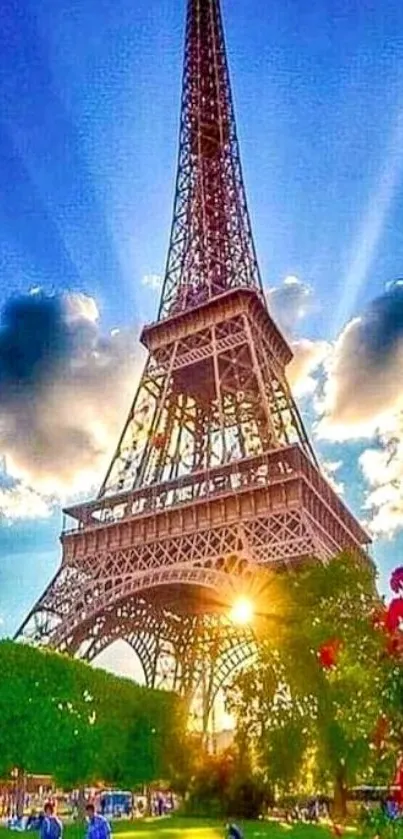 Eiffel Tower during sunset with a sunburst and vibrant sky.