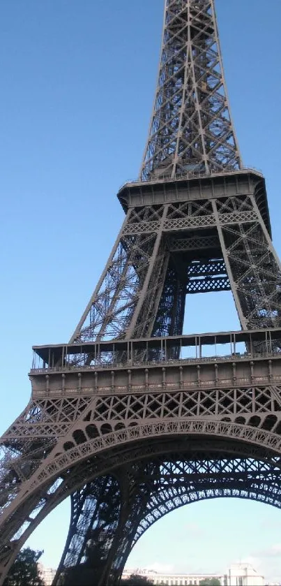 Eiffel Tower with blue sky in background.