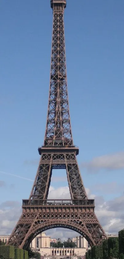 Eiffel Tower in Paris under a serene blue sky.