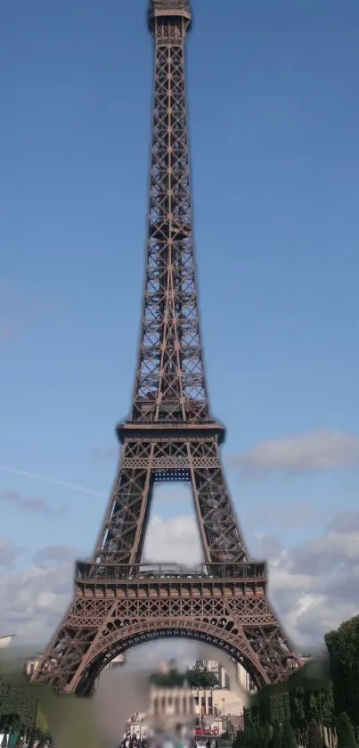 Eiffel Tower with a blue sky background on mobile wallpaper.