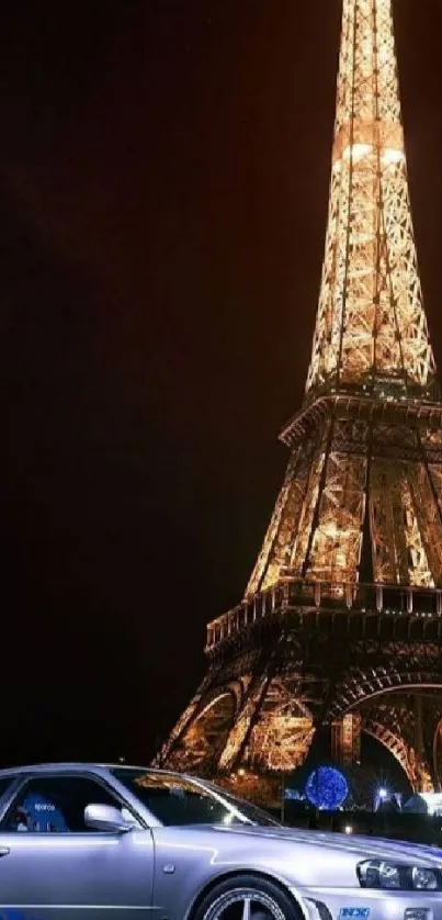 Illuminated Eiffel Tower with a sports car at night.