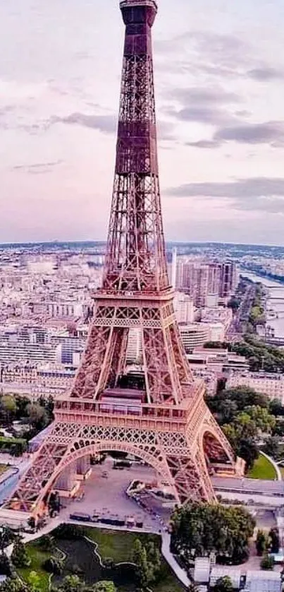 Aerial view of Eiffel Tower with a pastel pink Paris skyline.