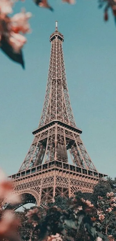 Eiffel Tower with spring flowers under a blue sky wallpaper.