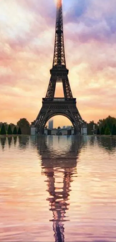 Eiffel Tower beautifully reflected in water during a vibrant sunset in Paris.