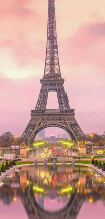 Eiffel Tower at sunset with pink sky and reflection.