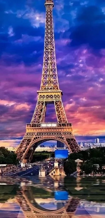 Eiffel Tower reflected on water against a vibrant sunset sky.