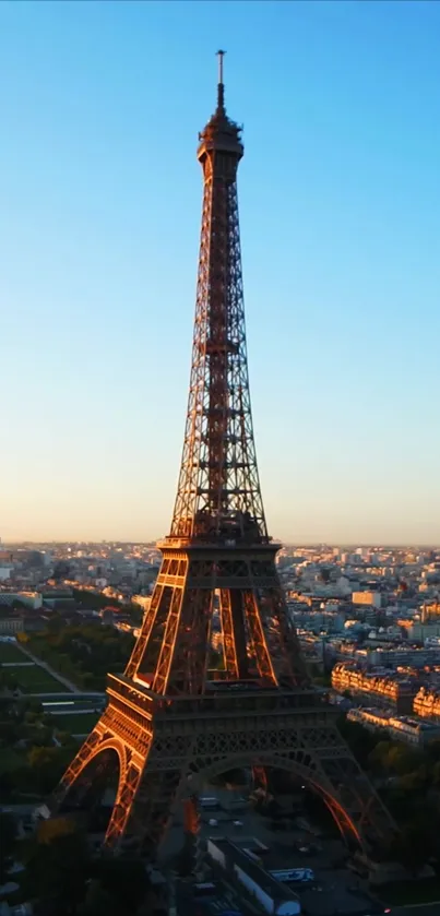 Eiffel Tower during sunset with cityscape view and vibrant sky.