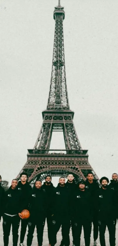 A group standing in front of the Eiffel Tower.