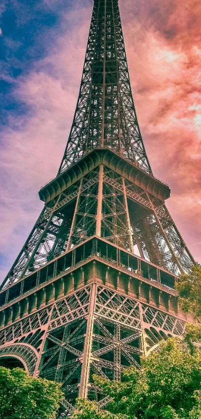 Eiffel Tower during a vibrant sunset with colorful sky.