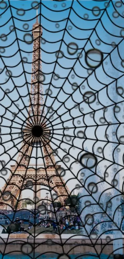 Eiffel Tower with spider web overlay on blue sky background.