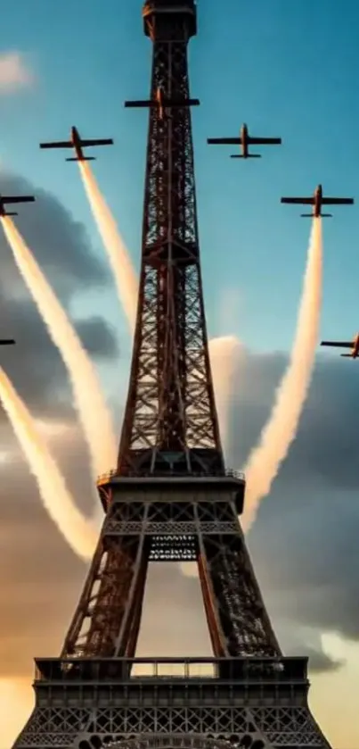 Eiffel Tower with planes against sunset sky.