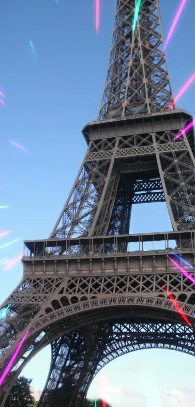 Eiffel Tower with neon streaks under a clear blue sky.