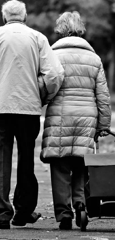 Elderly couple walking together in black and white. Serene and timeless.