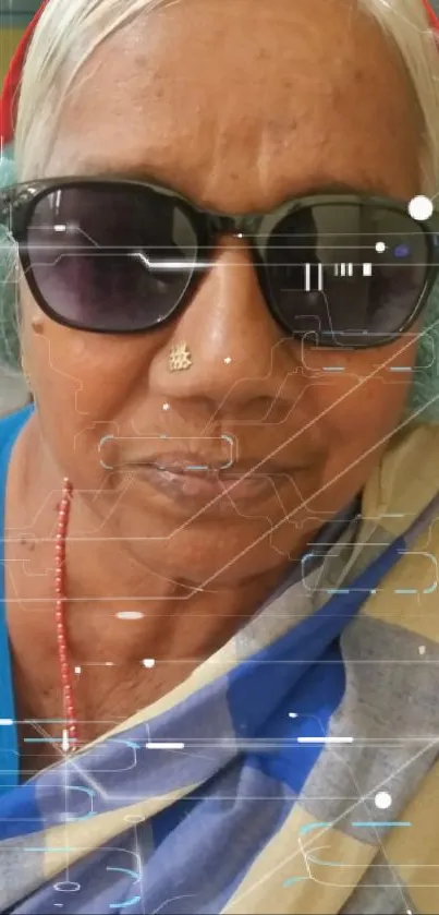 Elderly woman in sunglasses with tech effects, wearing a blue sari.