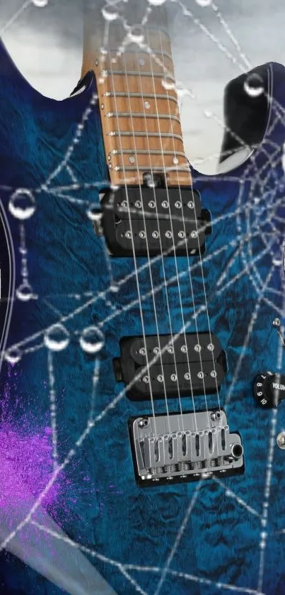 Blue electric guitar with raindrop art design.