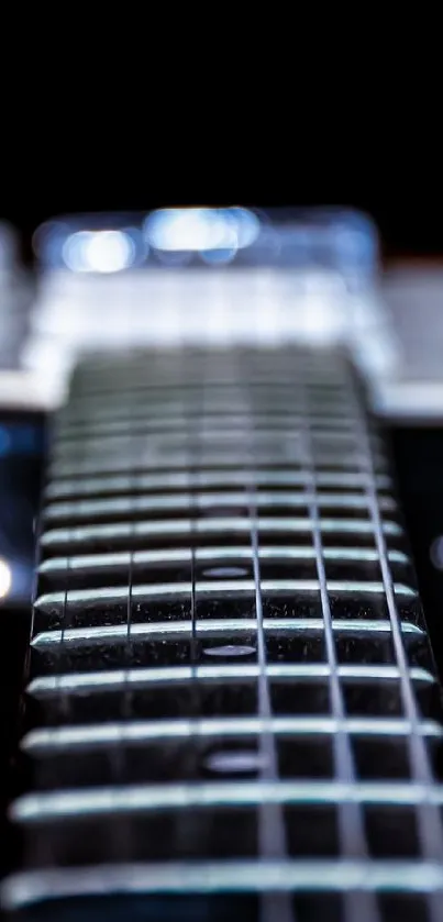 Electric guitar strings close-up with dark background.