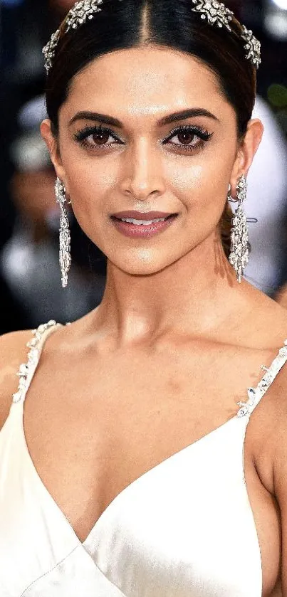 Woman in elegant white evening gown, stylish and poised.