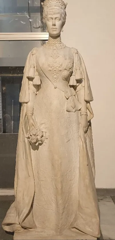 Statue of a queen in elegant stone attire.