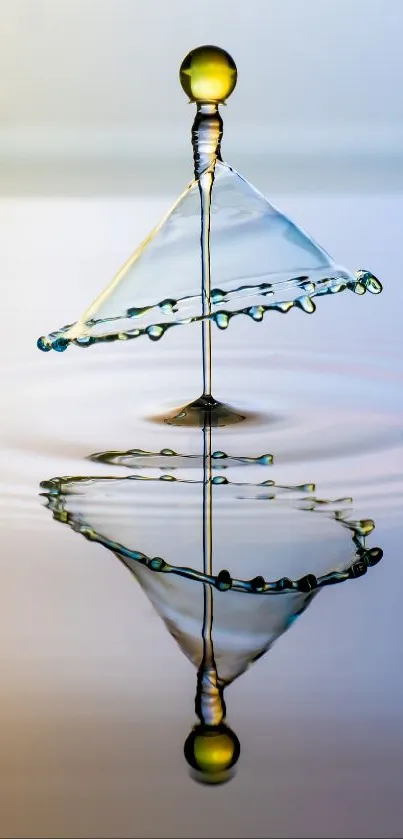 Artistic water droplet reflecting over a serene blue background.