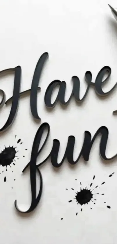Elegant 'Have Fun' script with ink splatters and pen.