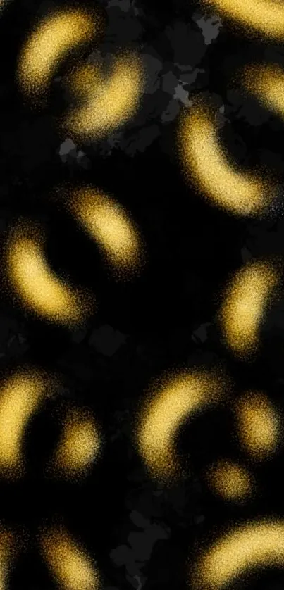 Abstract black and gold wallpaper with elegant, swirling patterns.