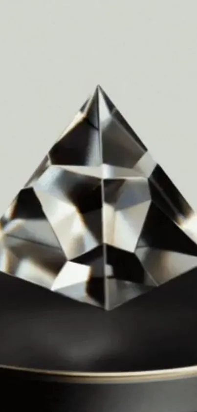 Elegant abstract pyramid with glass reflections on a dark background.