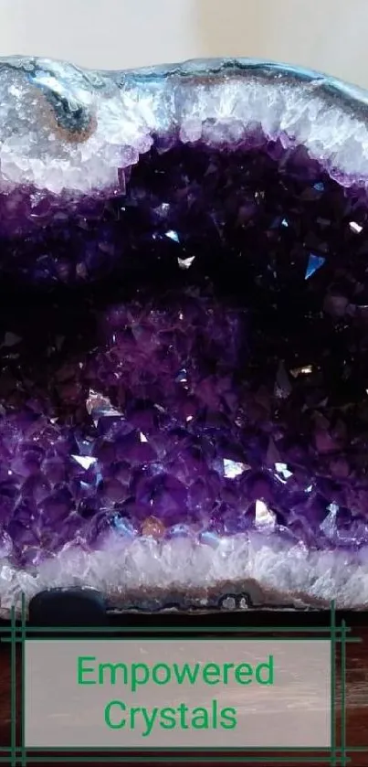 Mobile wallpaper featuring an amethyst geode with deep purple crystal formations.