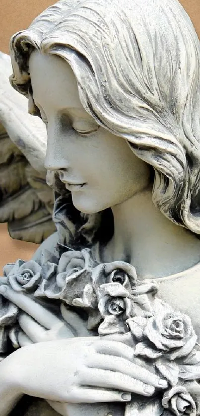 Elegant angel statue with wings and floral detail in a neutral tone.