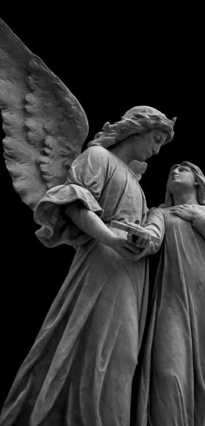 Monochrome angel statue with black background.