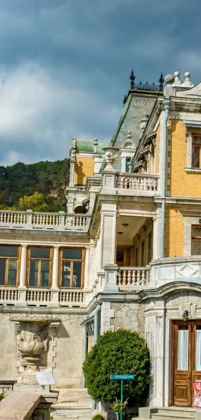 Elegant historic building with detailed architecture under a cloudy sky.