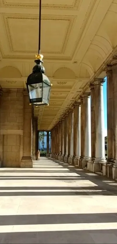 Elegant corridor with classic columns in sunshine.