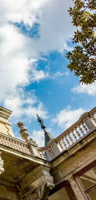 Elegant architectural building under a vibrant blue sky with tree leaves.