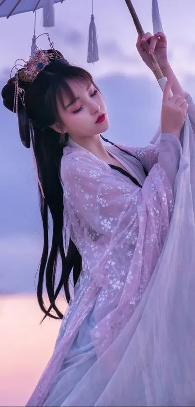 Elegant Asian princess in soft pastels holding an umbrella.