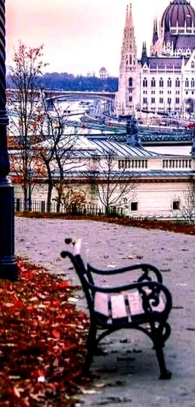 Elegant cityscape with bench, river, and historic building in autumn hue.