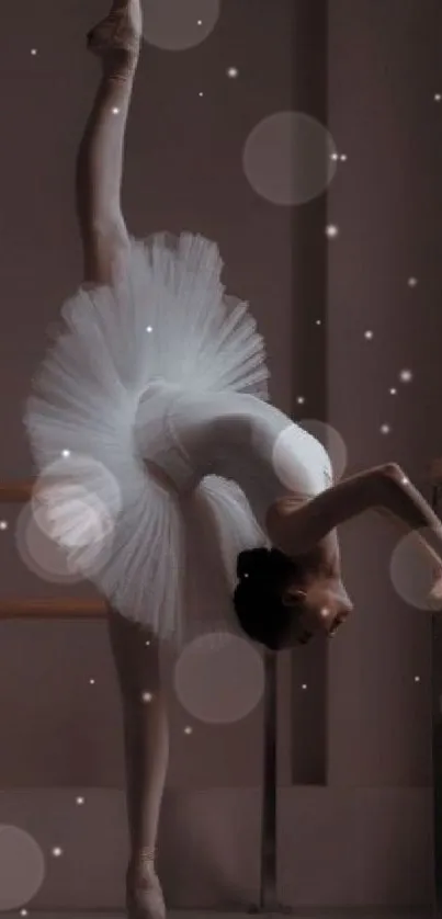 Ballet dancer in white tutu poses gracefully at barre.