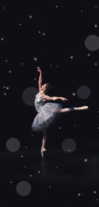 Ballerina striking a pose on a dark stage, exuding grace and elegance.