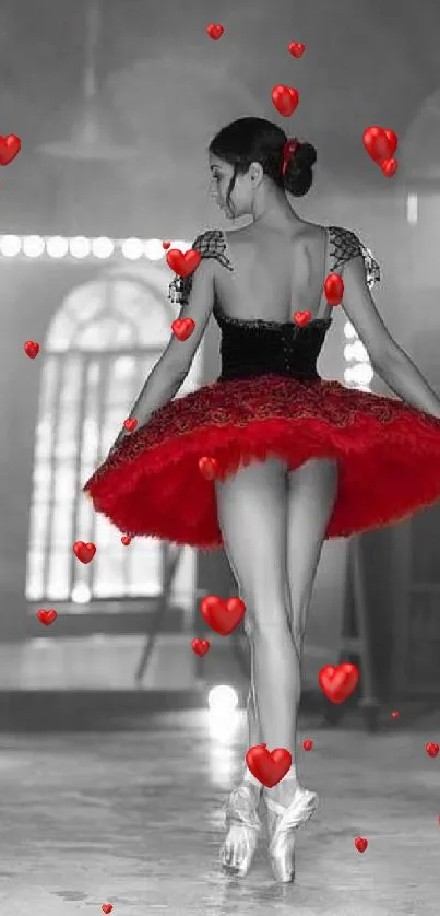 Ballerina in red tutu on a black and white stage.