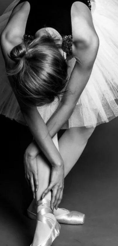 Ballet dancer in monochrome, poised elegantly.