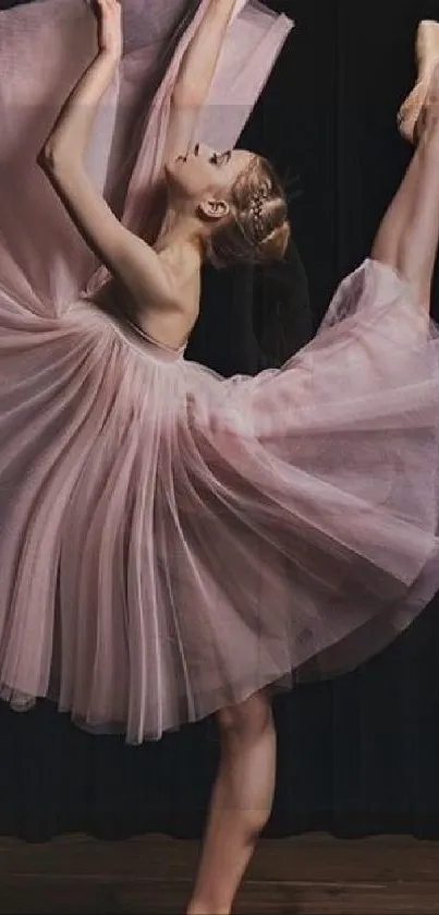 Elegant ballet dancer posing in a pink dress.