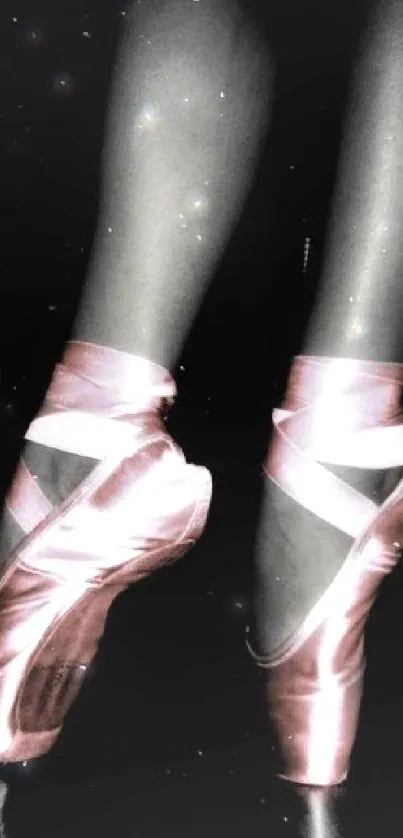 Elegant pink ballet pointe shoes on dark background.