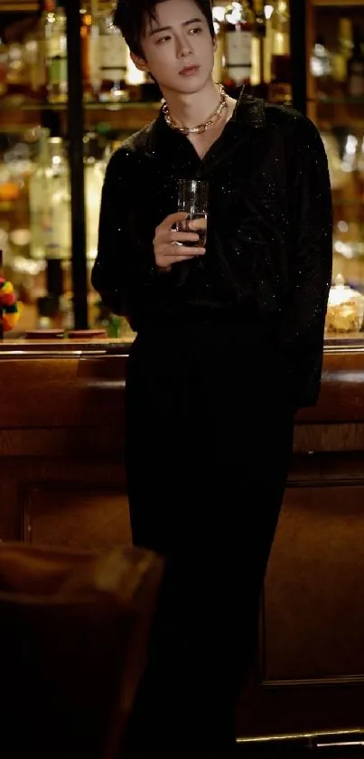 Man in a chic bar setting with elegant fashion.