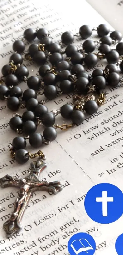 Open Bible with rosary beads and faith symbols on page.