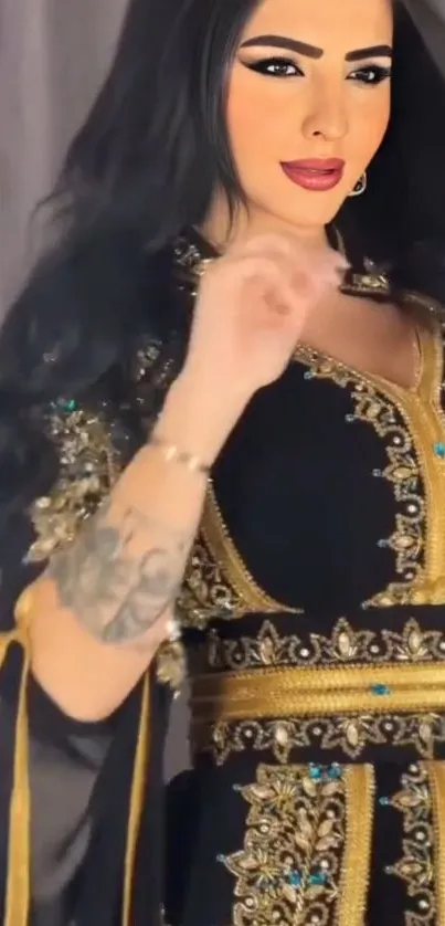 Woman in black and gold embroidered dress.