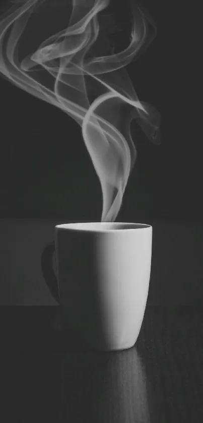 Black and white wallpaper with steaming coffee cup on a dark surface.