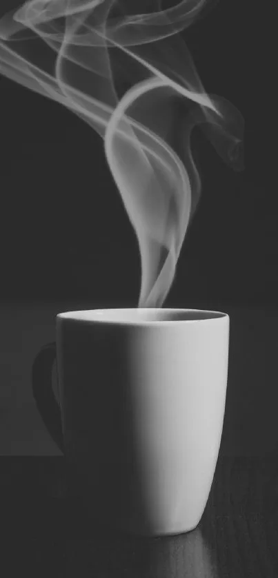 Black and white image of a steaming mug with elegant steam swirls.