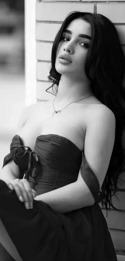 Elegant black and white portrait of a woman in a dress.