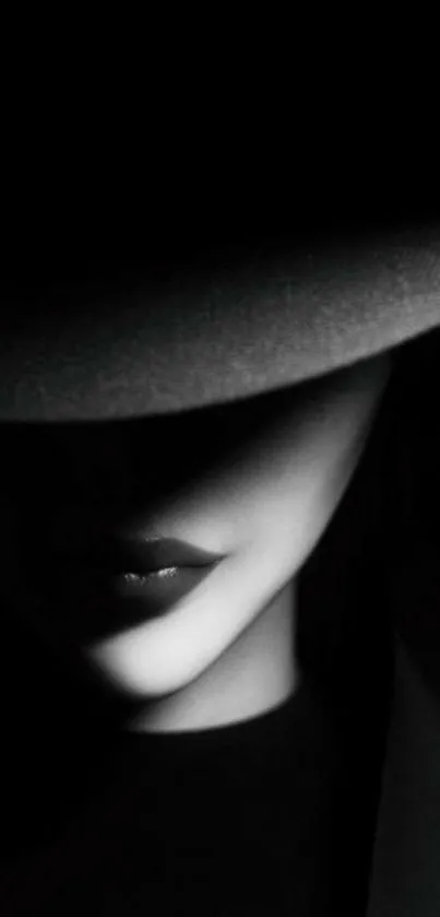 Mysterious noir wallpaper with a shadowed figure in a hat.