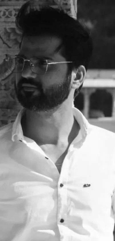 Black and white portrait of a man outdoors.